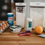 Muscovado Sugar - orange fruit beside white plastic bottle and red handled scissors