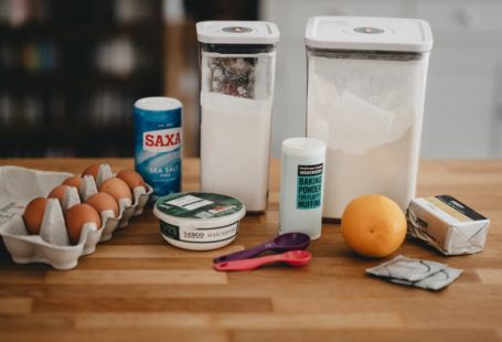 Muscovado Sugar - orange fruit beside white plastic bottle and red handled scissors