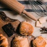 Demerara Sugar - brown wooden rolling pin beside brown wooden rolling pin