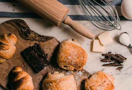 Demerara Sugar - brown wooden rolling pin beside brown wooden rolling pin