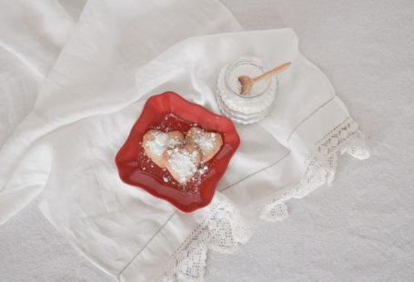 Turbinado Sugar - flat lay photography of heart-shaped cookies on red plate