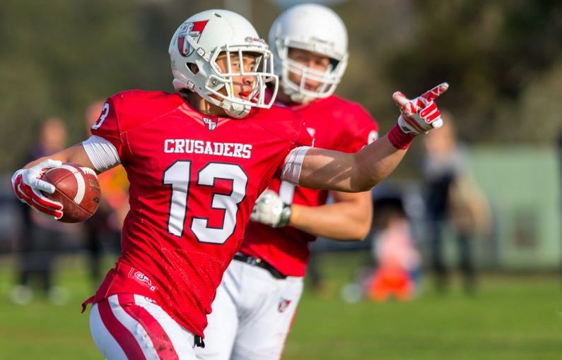 Crusader Helmet - people playing football
