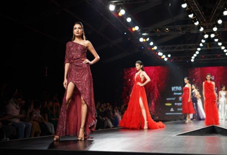 Fashion Runway - woman wearing maroon one-shoulder slit-side dress