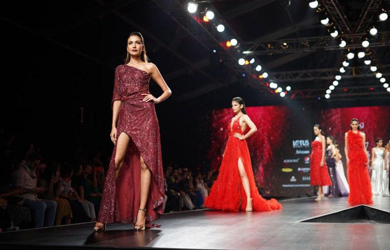 Fashion Runway - woman wearing maroon one-shoulder slit-side dress