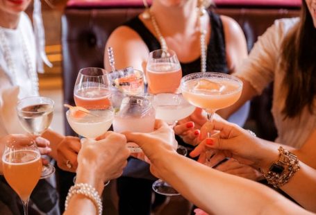 Cocktail Party - woman in black tank top holding clear wine glass