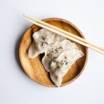 Fermented Drink - three white dimsum on brown bowl