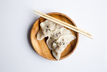 Fermented Drink - three white dimsum on brown bowl